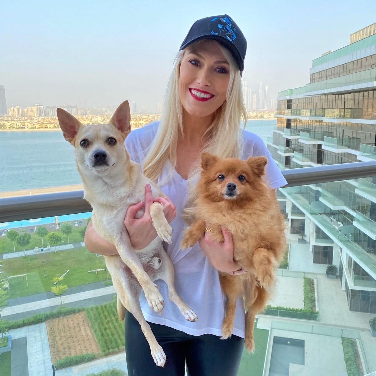  Alexandra Mary Hirschi holding her two cute dogs
